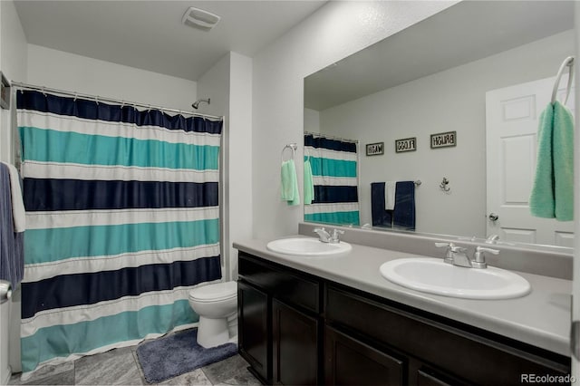 975 Alta St, Lochbuie, CO 80603 - bathroom featuring toilet, double vanity, and a shower with curtain