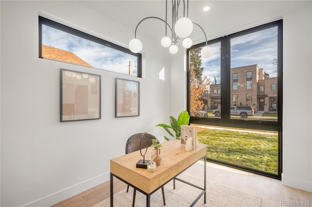 office area with light hardwood / wood-style flooring