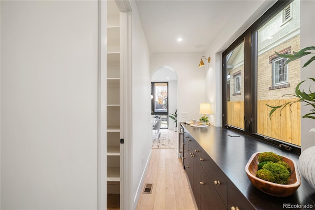 corridor featuring light hardwood / wood-style floors