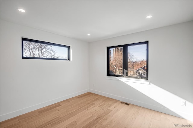 unfurnished room featuring light wood-type flooring