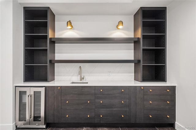 bar featuring wine cooler and sink