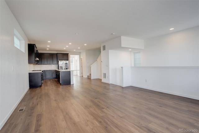 unfurnished living room with hardwood / wood-style flooring