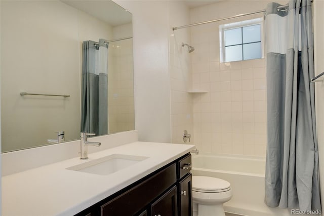 full bathroom featuring shower / bath combination with curtain, vanity, and toilet