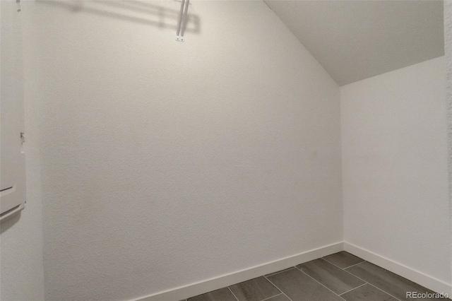 walk in closet featuring lofted ceiling