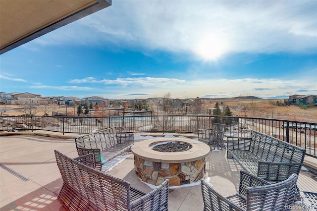 view of patio with an outdoor fire pit