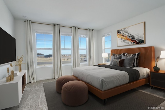 bedroom featuring light colored carpet