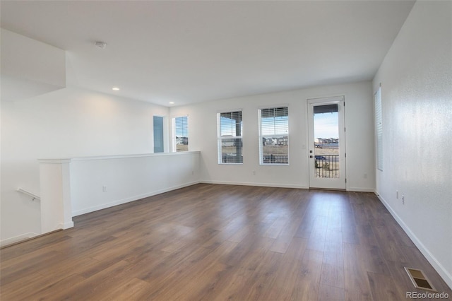 unfurnished room featuring dark hardwood / wood-style flooring