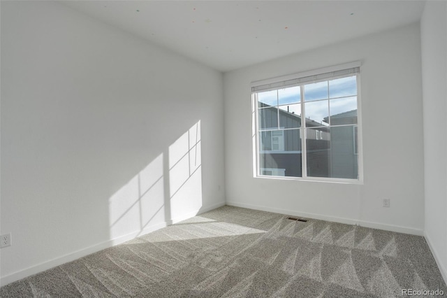 empty room featuring light colored carpet