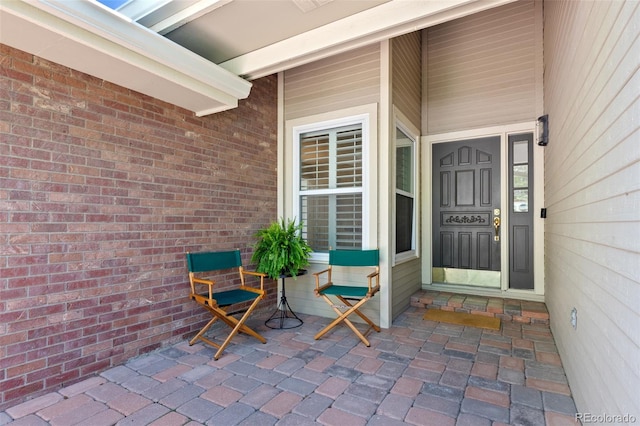 property entrance featuring a porch