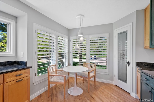 dining area with light wood-type flooring