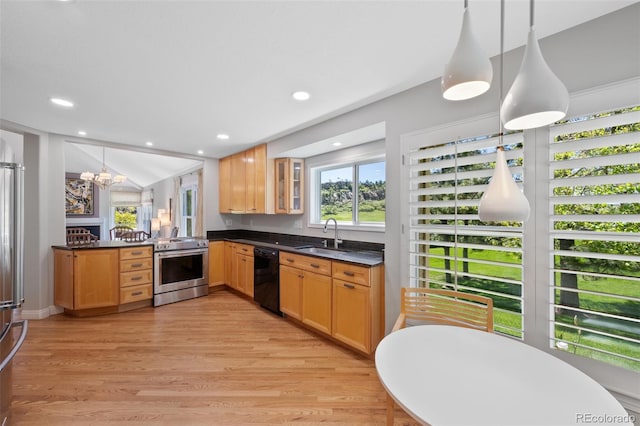 kitchen featuring hanging light fixtures, light hardwood / wood-style flooring, appliances with stainless steel finishes, kitchen peninsula, and sink