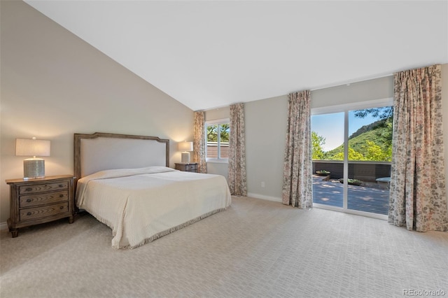 carpeted bedroom featuring access to outside and high vaulted ceiling