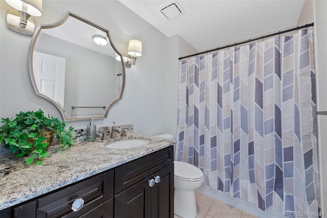 bathroom featuring tile flooring, oversized vanity, and toilet