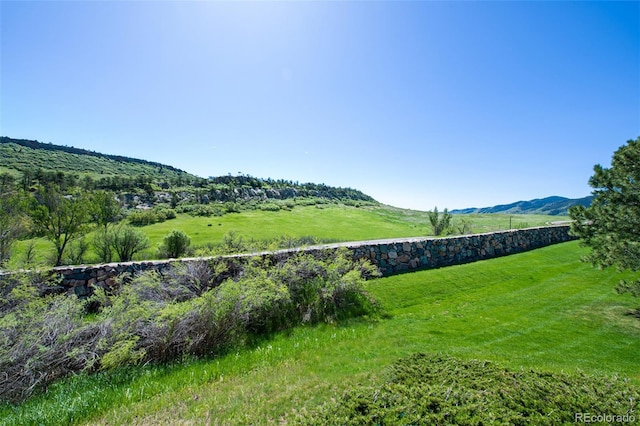 property view of mountains featuring a rural view