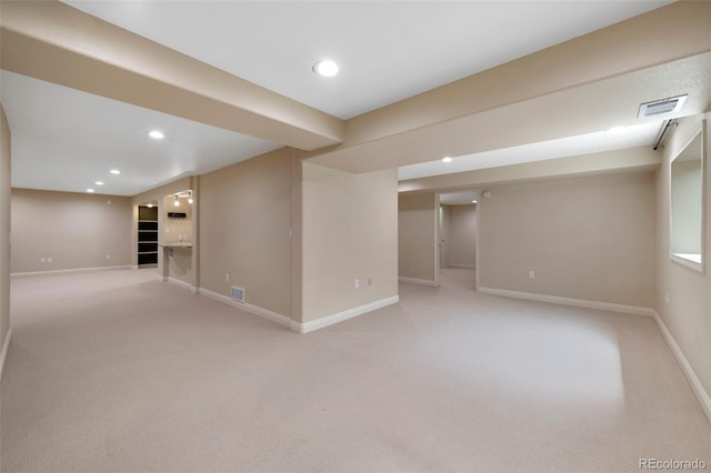 basement featuring carpet flooring