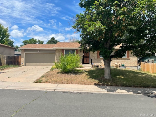 view of front of house with a garage and a front yard