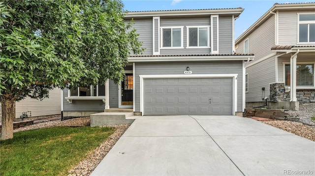 4458 Lyndenwood Pt, Highlands Ranch, CO 80130 - view of front of house featuring an attached garage and concrete driveway