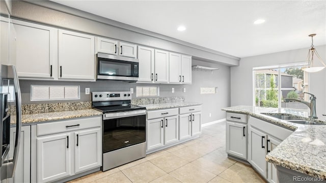 4458 Lyndenwood Pt, Highlands Ranch, CO 80130 - kitchen with appliances with stainless steel finishes, light tile patterned flooring, recessed lighting, pendant lighting, and light stone counters