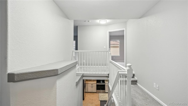 4458 Lyndenwood Pt, Highlands Ranch, CO 80130 - hallway with an upstairs landing and a textured wall
