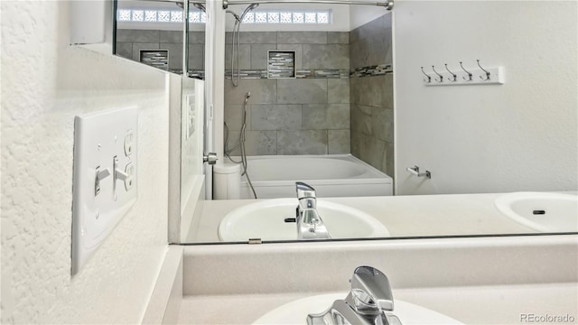 4458 Lyndenwood Pt, Highlands Ranch, CO 80130 - bathroom with bathtub / shower combination and vanity
