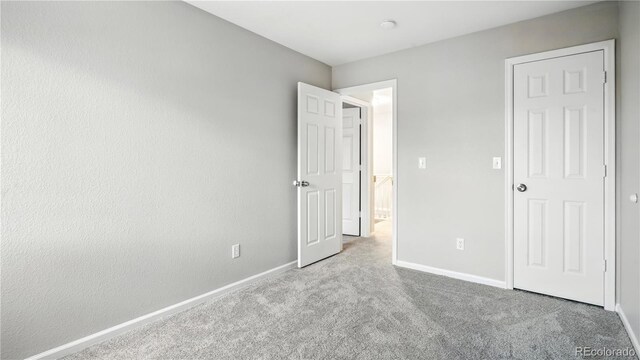 4458 Lyndenwood Pt, Highlands Ranch, CO 80130 - unfurnished bedroom featuring carpet flooring and baseboards
