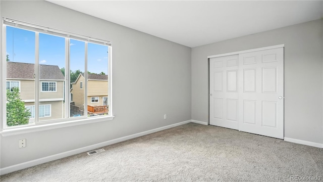4458 Lyndenwood Pt, Highlands Ranch, CO 80130 - unfurnished bedroom with carpet flooring and a closet