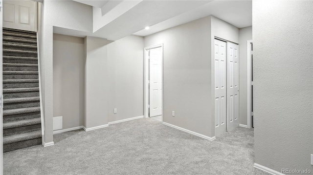 4458 Lyndenwood Pt, Highlands Ranch, CO 80130 - basement with stairway and carpet flooring
