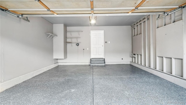 4458 Lyndenwood Pt, Highlands Ranch, CO 80130 - garage featuring baseboards