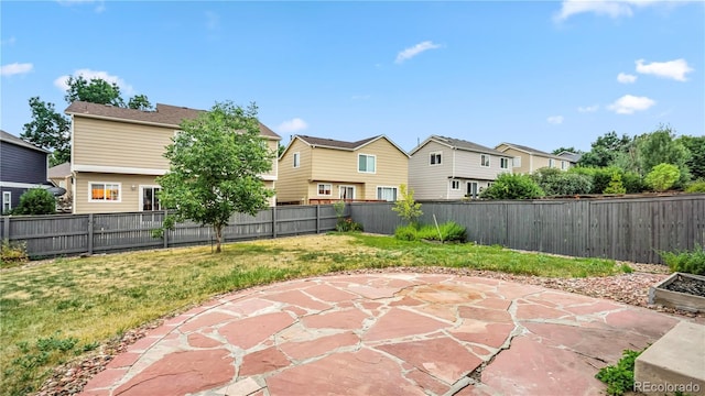 4458 Lyndenwood Pt, Highlands Ranch, CO 80130 - fenced backyard featuring a patio area and a residential view