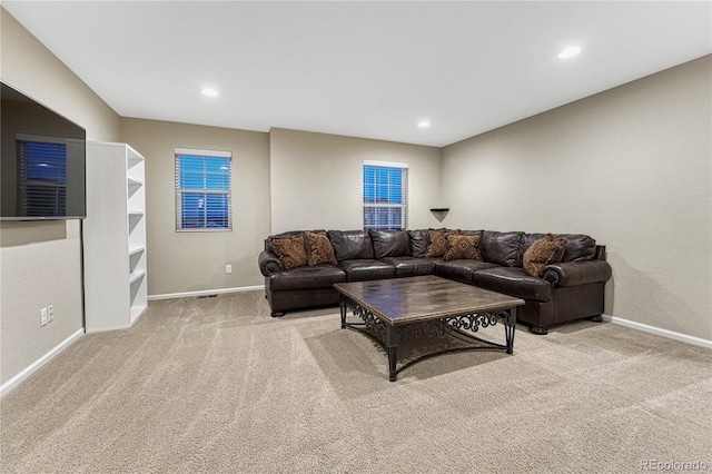 living area featuring baseboards, carpet flooring, and recessed lighting