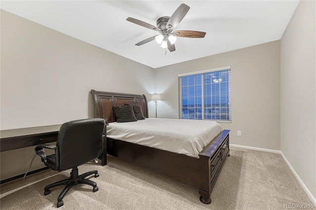 bedroom with baseboards, a ceiling fan, and light colored carpet