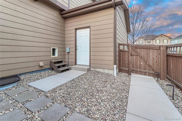 entrance to property featuring fence and a gate