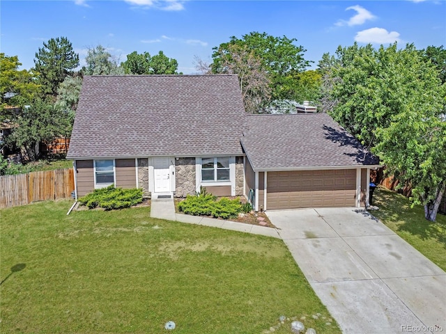 6579 Ingalls St, Arvada, CO 80003 - view of front facade featuring roof with shingles, driveway, stone siding, and an attached garage