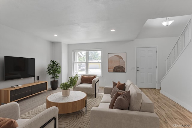 6579 Ingalls St, Arvada, CO 80003 - living area featuring wood finished floors, recessed lighting, and stairway