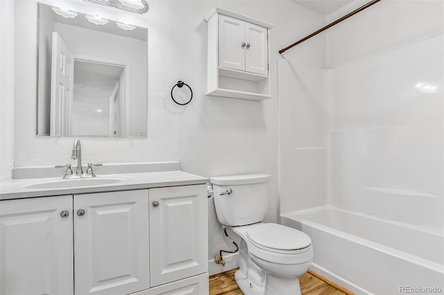 6579 Ingalls St, Arvada, CO 80003 - full bathroom featuring wood finished floors, vanity, and shower / tub combination