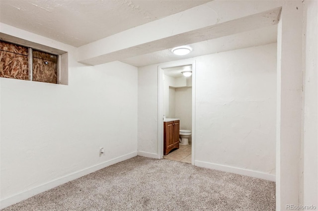 6579 Ingalls St, Arvada, CO 80003 - finished basement featuring light carpet and baseboards