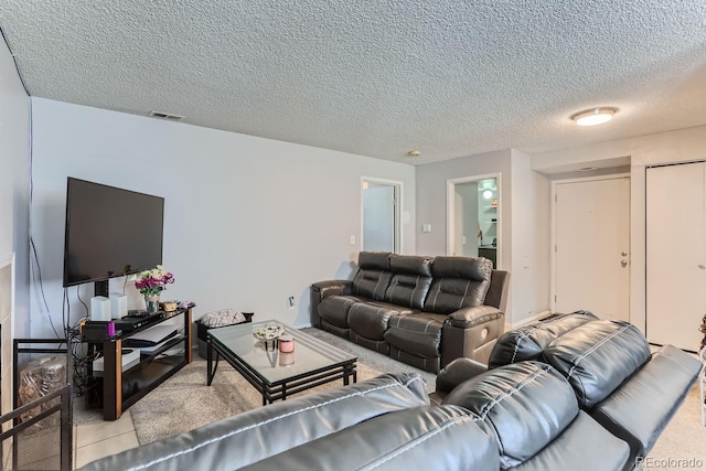 living room with a textured ceiling