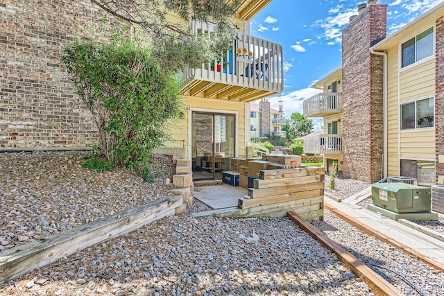 exterior space featuring a balcony and a patio