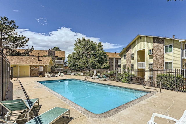 view of swimming pool with a patio area