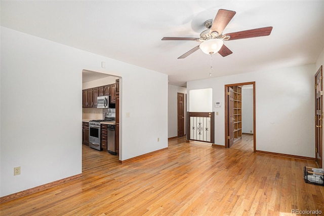 3272 S Joplin Ct, Aurora, CO 80013 - unfurnished living room with light wood-style flooring and ceiling fan