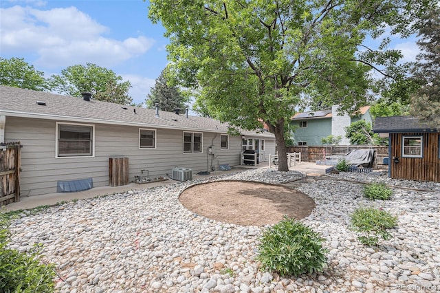 3272 S Joplin Ct, Aurora, CO 80013 - rear view of house featuring a patio area, a shed, and a wooden deck