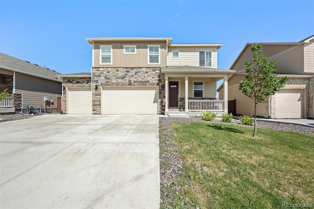 437 Thrush Pl, Johnstown, CO 80534 - view of front of house featuring covered porch, concrete driveway, a front lawn, an attached garage, and stone siding