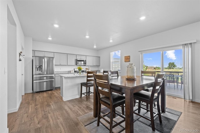437 Thrush Pl, Johnstown, CO 80534 - dining area with wood finished floors and recessed lighting