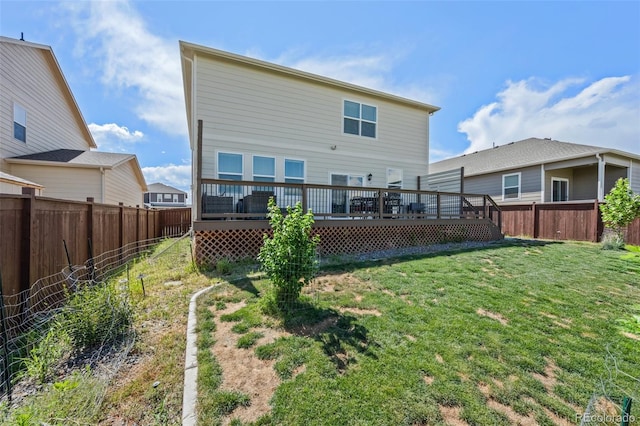 437 Thrush Pl, Johnstown, CO 80534 - rear view of house with a fenced backyard and a deck