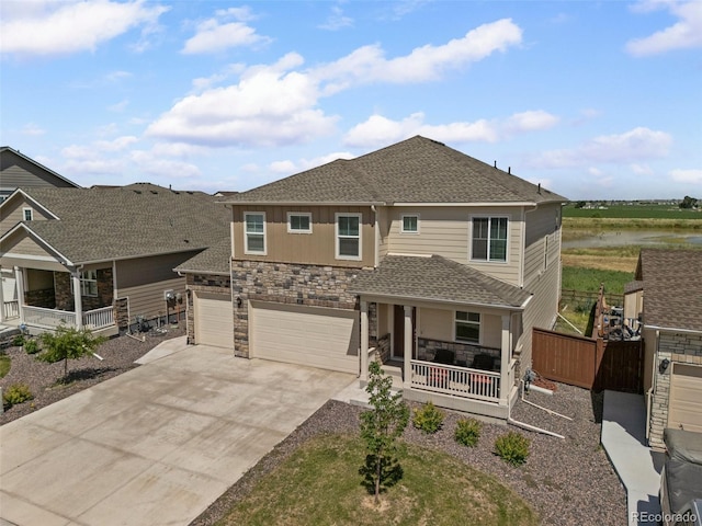 437 Thrush Pl, Johnstown, CO 80534 - craftsman-style home with a porch, stone siding, concrete driveway, a shingled roof, and a garage