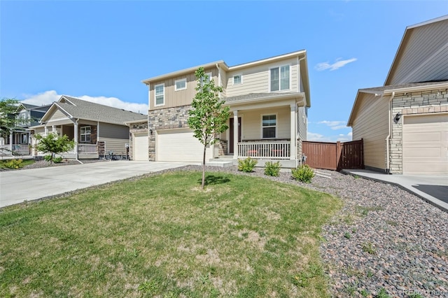 437 Thrush Pl, Johnstown, CO 80534 - view of front of house with covered porch, an attached garage, concrete driveway, and stone siding