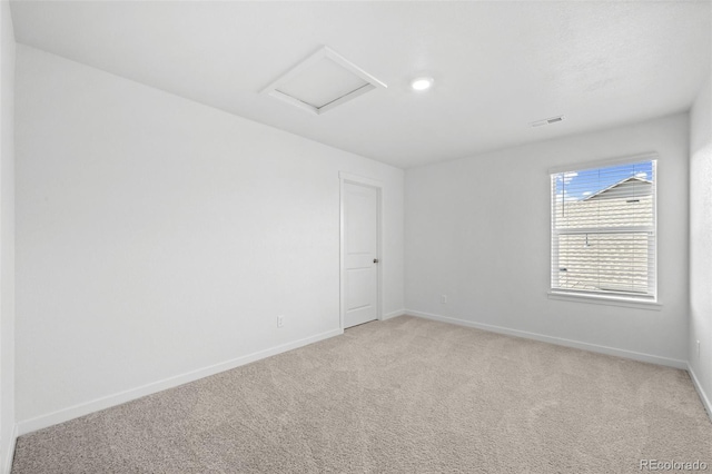 437 Thrush Pl, Johnstown, CO 80534 - unfurnished room with light colored carpet and attic access