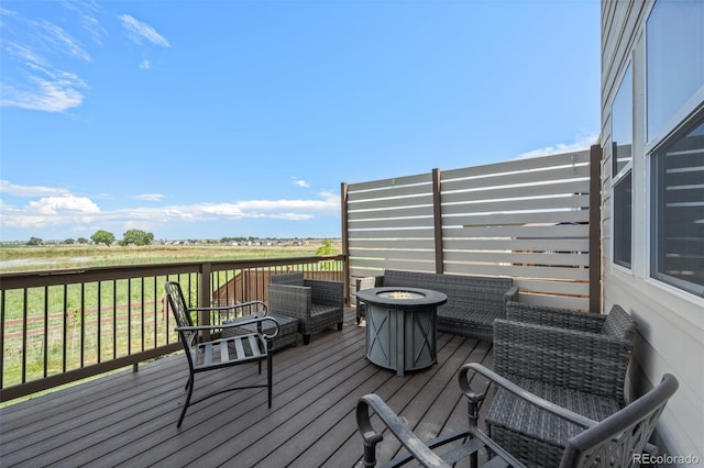437 Thrush Pl, Johnstown, CO 80534 - wooden terrace with a fire pit