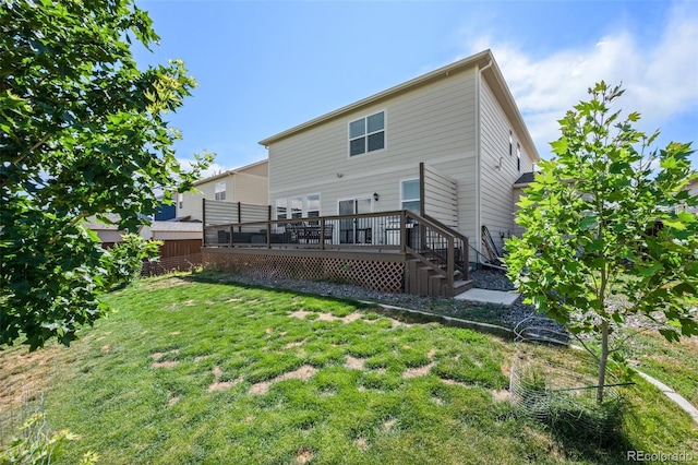 437 Thrush Pl, Johnstown, CO 80534 - back of house featuring a deck, a yard, and stairs
