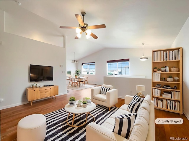 4011 W 28th Street Rd, Greeley, CO 80634 - living room featuring lofted ceiling, ceiling fan, and wood finished floors